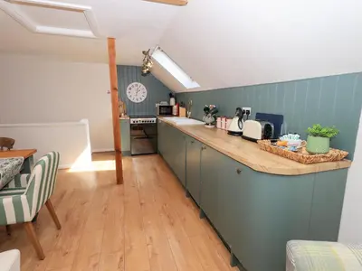 a kitchen with a counter top in a room at Corner Cottage in Penrith