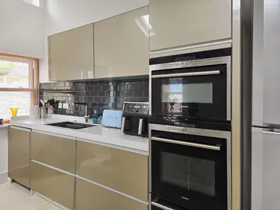 a kitchen with stainless steel appliances in a kitchen at The St Bees Knees in St Bees