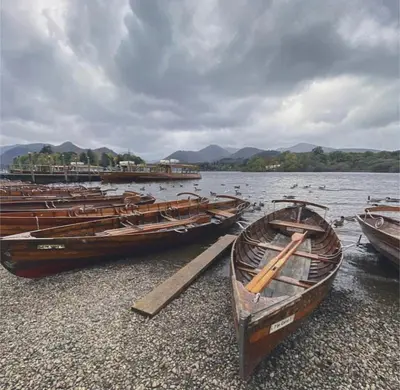 a group of boats sitting on the shore at Zions Retreat in Plumbland