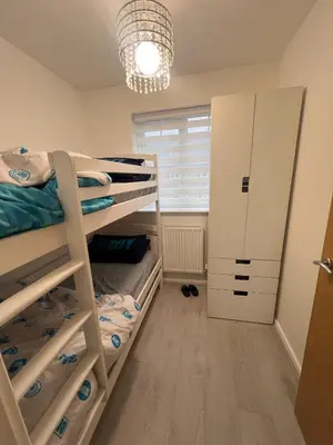 a bedroom with bunk beds and a window at Z&Z Villa in Moffat