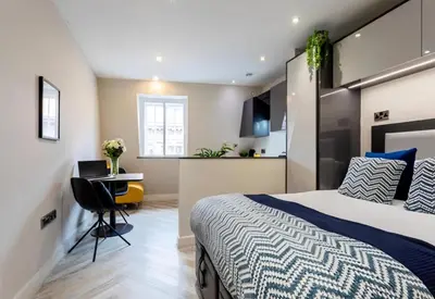 a bedroom with a bed and a desk at 121 Princess Street in Moffat