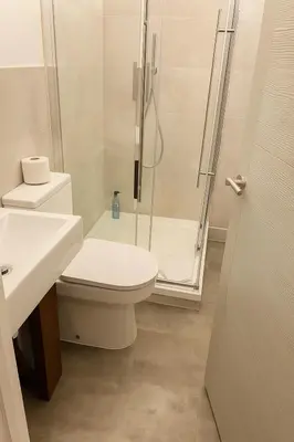 a bathroom with a shower and a toilet and a sink at High living @ Ferguson Court in Carlisle