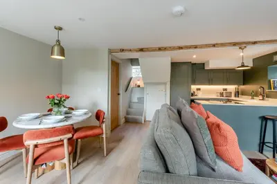 a living room with a couch and a table at 2 Bed in Chapel Stile oc-u32104 in Chapel Stile