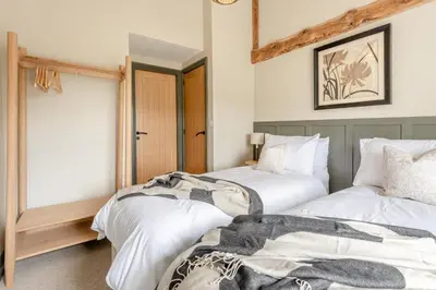two beds sitting next to each other in a room at 2 Bed in Chapel Stile oc-u32104 in Chapel Stile