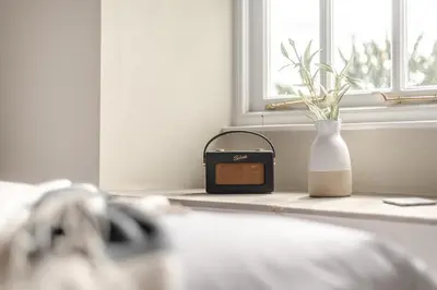 a clock and a vase sitting on a window sill at 2 Bed in Chapel Stile oc-u32104 in Chapel Stile