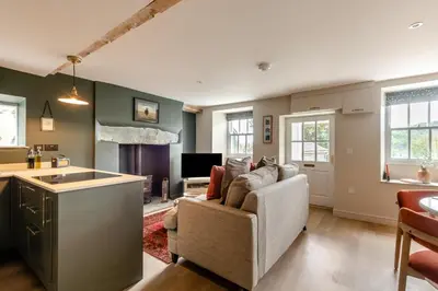 a living room with a couch and a kitchen at 2 Bed in Chapel Stile oc-u32104 in Chapel Stile