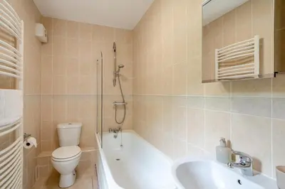 a bathroom with a toilet and a tub and a sink at 3 Bed in Ravenglass oc-e32106 in Ravenglass