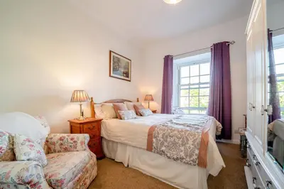 a bedroom with two beds and a window at 2 Bed in Moffat oc-a32121 in Moffat