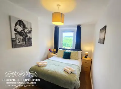 a bedroom with a bed and a window at Moon Cottage By Prestige Properties SA in Egremont