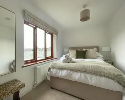 a bedroom with a bed with two teddy bears on it at Mill House in Braithwaite