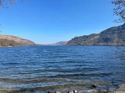 a view of a lake with mountains in the background at Rattlebeck Cottage in Glenridding