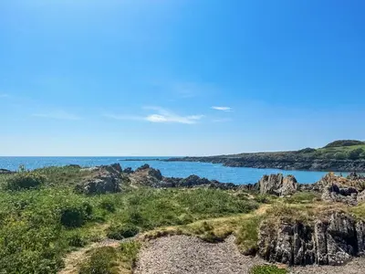 a view of the ocean from a rocky beach at Ninians Landing in Kirkcudbright
