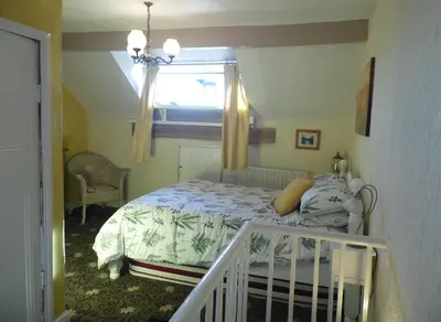 a bedroom with a bed and a window at 2 Bedroom & 2Bathrooms in Lancaster in Moffat