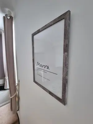 a mirror hanging on a wall next to a door at Sycamore Cottage, Western Lakes Bolthole With Views Across the Fells in Arlecdon