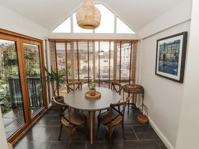 a dining room with a table and chairs at 43 Station Road in Keswick