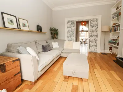 a living room with a couch and a table at 43 Station Road in Keswick