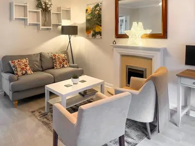 a living room with a couch and a table at Rubby Banks Retreat in Cockermouth
