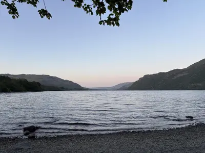 a view of a body of water with mountains at Swirral Edge Cottage in Penrith