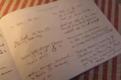 a book with handwriting on the pages at The Biscuit Box Ideal For Couples Or Families in Low Hesket