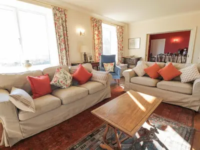 a living room with two couches and a table at Claymoddie in Newton Stewart