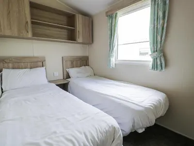 two beds sitting next to each other in a bedroom at Manor House Gold 2 Bedroom 20C in Maryport