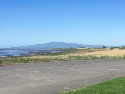 an empty parking lot next to a body of water at The Haven in Annan
