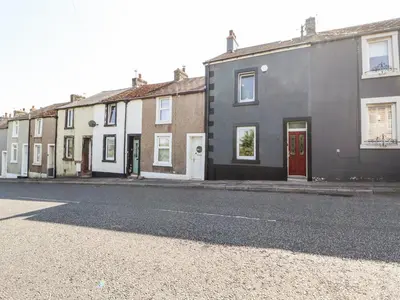 a row of houses on the side of a street at 10 Keekle Terrace in Cleator Moor
