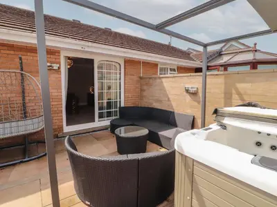 a patio with a couch and a table at 3 Hawk Place in Whitehaven