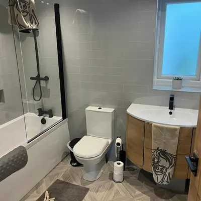 a bathroom with a toilet and a sink at The Fishermans Rest in Castle Douglas