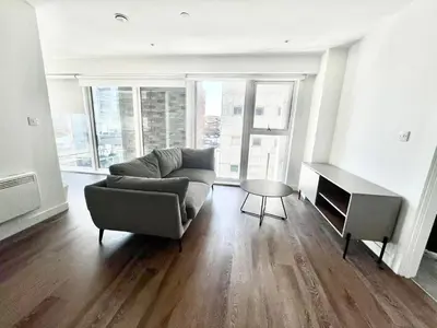 a living room with a couch and a table at Blucher St in Moffat