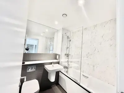a white bathroom with a sink and a toilet at Blucher St in Moffat