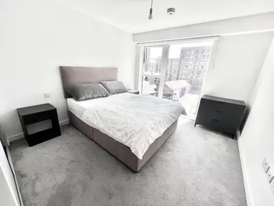 a bedroom with a bed and two night stands at Blucher St in Moffat