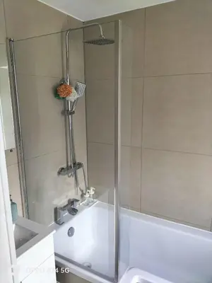 a shower in a bathroom with a sink at Quiet 5BR Ideal for Groups in Moffat