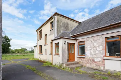 an old stone house with a driveway at Shawsmill, outside Hurlford in Hurlford