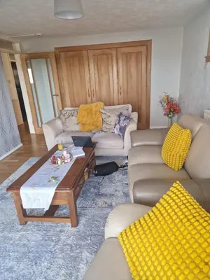 a living room with a couch and a coffee table at Vibrant Room in Centeral Ayr in Ayr