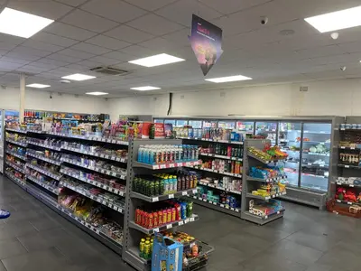 a store filled with lots of products on shelves at Static Caravan in Moffat