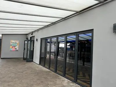 an empty building with glass doors and windows at Static Caravan in Moffat