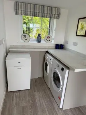a laundry room with a washing machine and a window at Burn Bungalow, Longtown ideal for stop overs when travelling, 5 minutes from the M6 in Longtown