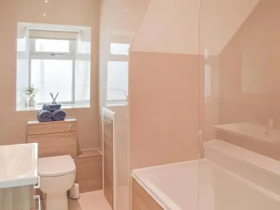 a bathroom with a toilet and a sink at High Wardneuk - Uk47041 in Symington