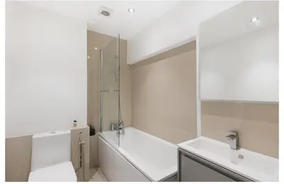 a bathroom with a tub and a sink and a shower at 2 Bedroom Apartment Queensway in Moffat