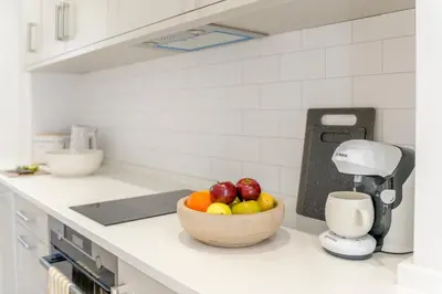 a bowl of fruit on a counter in a kitchen at 1 Bed in Dalston oc-s32206 in Dalston