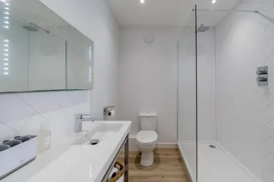 a bathroom with a sink and a toilet and a shower at 1 Bed in Dalston oc-s32206 in Dalston