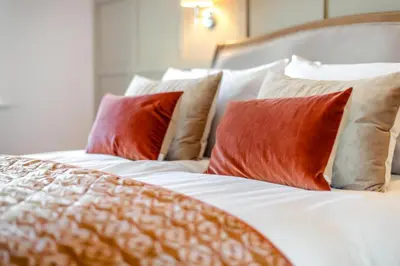 a bed with red and white pillows on it at 2 Bed in Dalston oc-g32205 in Dalston