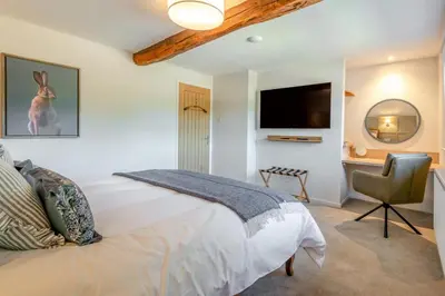 a bedroom with a bed and a desk and a television at 2 Bed in Dalston oc-g32205 in Dalston