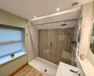 a bathroom with a shower and a sink at Two Chimneys in Keswick