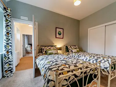 a bedroom with two beds in a room at 2 Bed in Maybole 96012 in Maybole