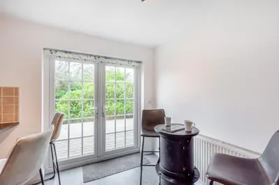 a dining room with a table and chairs and a window at 5 Bed in St. Bees oc-w32446 in St Bees