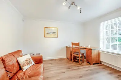 a living room with a couch and a desk at 5 Bed in St. Bees oc-w32446 in St Bees