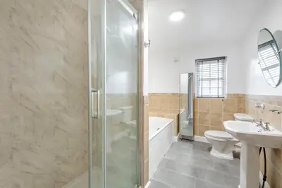 a bathroom with a shower and a toilet and a sink at 5 Bed in St. Bees oc-w32446 in St Bees