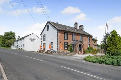 a building on the side of a road next to a street at 2 Bed in Troutbeck oc-s32564 in Troutbeck